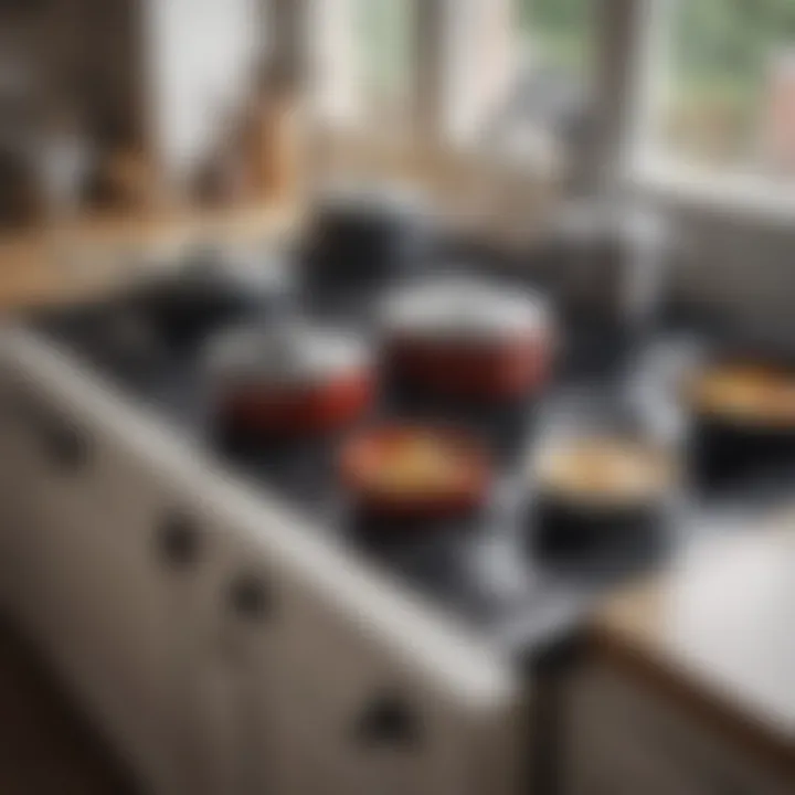 A well-organized kitchen with ceramic stove top pans neatly stacked and ready for use.