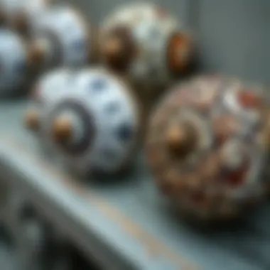 Close-up view of intricate patterns on antique ceramic knobs.