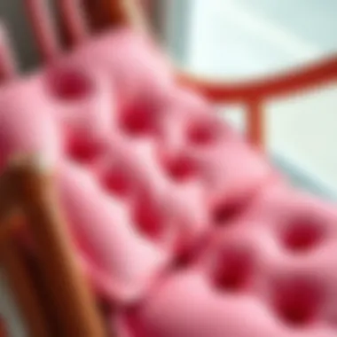 Close-up of luxurious materials used in pink rocking chair pads