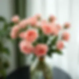 Elegant arrangement of mini fake rose flower heads in a decorative vase